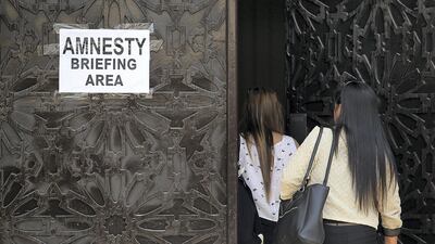 Amnesty seekers walk into a briefing area at the Phillipines Consulate in Dubai. Satish Kumar for The National
