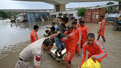 National Disaster Response Force personnel rescue people from areas flooded by the Yamuna river in Delhi. AFP