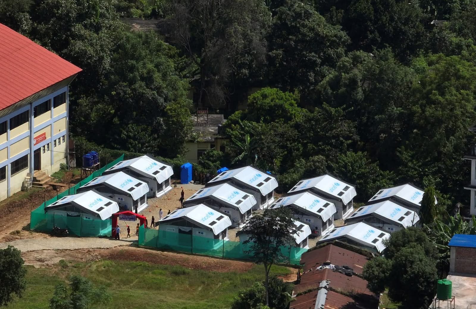Twenty tents provided by Unicef serve as a temporary school for more than 1,600 pupils of a Nepal secondary school that was washed away in the country's worst floods in August this year. Photo: Rajendra Dawadi