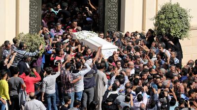 Mourners carry a coffin during the funeral of Coptic Christians who were killed in the Friday attack. Reuters/Mohamed Abd El Ghany