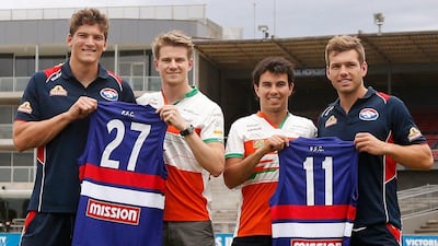 Nico Hulkenberg and Sergio Perez of Formula One team Force India show off their own Western Bulldogs Australian Football League shirts. Darrian Traynor / Getty Images