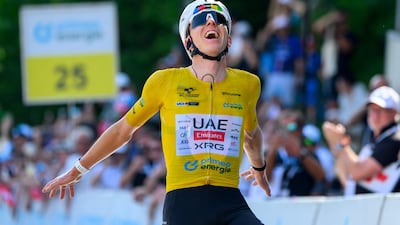 UAE Team Emirates-XRG rider Tadej Pogacar celebrates as he crosses the finish line to win the fifth and final stage of the Tour de Suisse. AFP