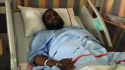 Ismail Khamis is being treated for broken legs and burns in Rashid Hospital, Dubai. Nawal Al Ramahi / The National