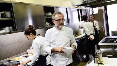 Italian chef Massimo Bottura working in the kitchen of his restaurant Osteria Francescana in Modena. Giuseppe Cacace / AFP