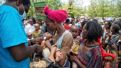 UN aid workers screen children for malnutrition in Tigray. Unicef via AP