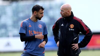 Manchester United's Bruno Fernandes talks to manager Erik ten Hag. AFP