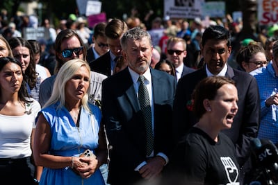 Marjorie Taylor Greene, a Republican Representative from Georgia, left, Rep Thomas Massie, a Republican from Kentucky, and Rep Ro Khanna, a Democrat from California, stand behind Jena-Lisa Jones, a survivor of deceased financier Jeffrey Epstein's sex trafficking ring. Bloomberg
