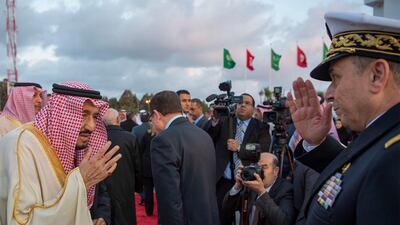 A handout photo made available by the Saudi Royal Palace shows Saudi King Salman bin Abdulaziz Al Saud (L) greeting delegates upon his arrival in Tunis, Tunisia. EPA