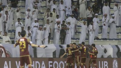 Al Wahda players celebrate their last-minute winner against Sharjah in the President's Cup semi-final. Jeffrey E Biteng / The National