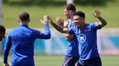 England's Jadon Sancho, right.