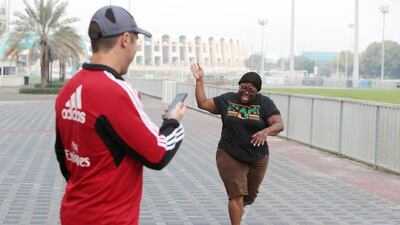 April Robinson, The National’s deputy art director, participates in a feel-good workout that’s part of the Primal Transformation challenge. Christopher Pike / The National