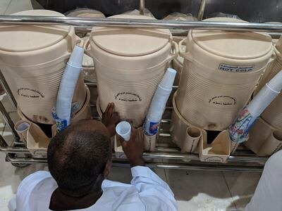 Containers of zamzam water are distributed across the mosque