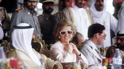 The Prince and Princess of Wales watching camel racing in the desert at Al Ain while on an official tour of Abu Dhabi. Getty Images