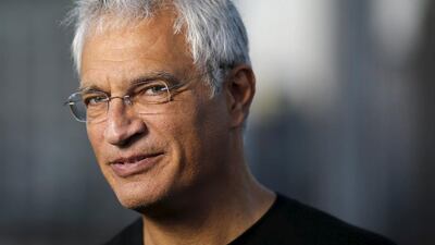 American photographer and documentary film director Louie Psihoyos speaks to the media before images are projected onto the Empire State Building as part of an endangered species projection to raise awareness, in New York August 1, 2015. Eduardo Munoz / Reuters