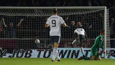 Manchester United striker Marcus Rashford, second right, scores his team’s third goal. Ben Stansall / AFP