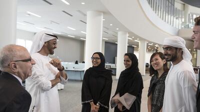 Sheikh Mohammed bin Zayed with NYUAD students and Al Bloom, vice-chancellor of the university, left. Ryan Carter / Crown Prince Court - Abu Dhabi