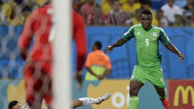 Emmanuel Emenike of Nigeria powers past Emir Spahic of Bosnia before crossing to Peter Odemwingie for Nigeria's goal in a 1-0 win on Saturday at the 2014 World Cup. Dolores Ochoa / AP