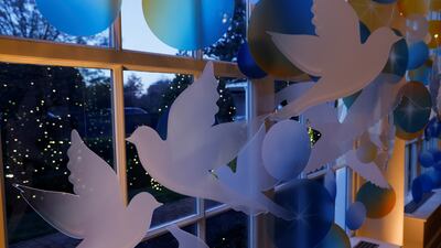 Doves and shooting stars decorate the East Colonnade of the White House. Reuters