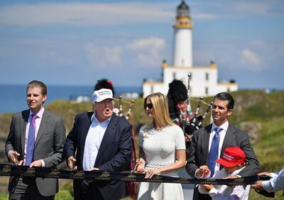 Eric Trump, left, with former US president Donald Trump, his daughter Ivanka and Donald Trump junior with hisdaughter Kai Trump at the course in Ayr. Getty