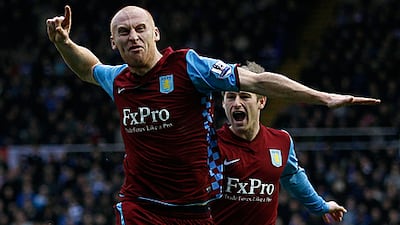 Aston Villa's James Collins celebrates his side's equaliser in their 1-1 draw with city rivals Birmingham.