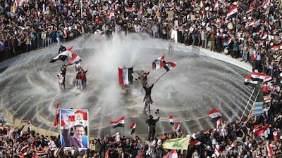 Syrians show their support for president Bashar Al Assad in the early days of the war. Five years on, most Syrians yearn for peace but do not want to be ruled by Al Assad. (Louai Beshara / AFP)