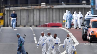 Forensic investigators work on London Bridge after an attack left 7 people dead and dozens injured in London, yesterday. Dylan Martinez / Reuters