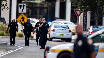 Police gather after an active shooter was reported at the Jacksonville Landing. AP Photo