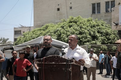Hazem Qassem, left, Hamas spokesman, and Ismail Al Thawabta, head of Gaza Media Office, announcing the resignation of the territory’s government. Bloomberg