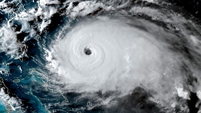 This satellite image obtained from NOAA/RAMMB, shows Tropical Storm Dorian as it approaching the Bahamas and Florida at 22:20UTC on August 31, 2019. Dorian changed course slightly on Saturday, possibly putting it on track to hit the Carolinas rather than Florida as previously forecast, after a dangerous blast through the Bahamas. Meteorologists said Dorian has grown into an extremely dangerous Category 4 storm as it heads toward land. - RESTRICTED TO EDITORIAL USE - MANDATORY CREDIT "AFP PHOTO / NOAA/RAMMB/HANDOUT" - NO MARKETING - NO ADVERTISING CAMPAIGNS - DISTRIBUTED AS A SERVICE TO CLIENTS / AFP / NOAA/RAMMB / HO / RESTRICTED TO EDITORIAL USE - MANDATORY CREDIT "AFP PHOTO / NOAA/RAMMB/HANDOUT" - NO MARKETING - NO ADVERTISING CAMPAIGNS - DISTRIBUTED AS A SERVICE TO CLIENTS