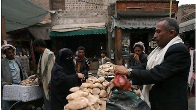 Yemenis shop for foodstuffs at a market in Sanaa: there are fears that the country will run out of food in three weeks. Mohammed Huwais / AFP Photo