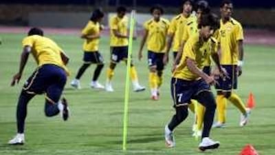 The striker Ali Mabkhout, No 7, and his Under 20 teammates train at Alexandria Stadium.