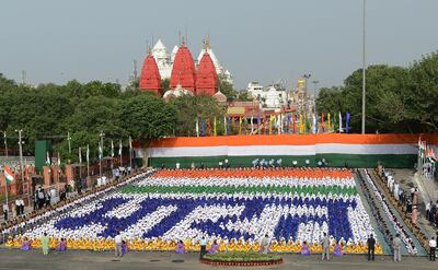 Indian schoolchildren sit in formation forming the word 'Bharat' (India). Money Sharma / AFP