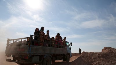 People fleeing areas of conflict ride a vehicle, north of Raqqa city, Syria November 8, 2016. REUTERS/Rodi Said