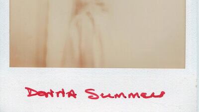 Donna Summer poses for a Polaroid portrait in 1975. Ginny Winn / Getty Images