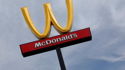 McDonald's logo upside down in honour of International Women's Day in March. The firm's sales have grown.