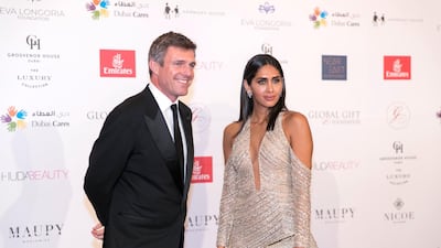 MCs TOM URQUHART and ENGY KIWAN at the Global Gift Gala red carpet. The gala returns to Dubai for the sixth time. The event is held at the Grosvenor House.