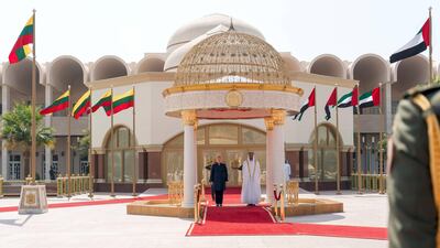Sheikh Mohammed bin Zayed, Crown Prince of Abu Dhabi Deputy Supreme Commander of the Armed Forces, and Dalia Grybauskait President of Lithuania, stand for the national anthem during a reception at Mushrif Palace. Rashed Al Mansoori / Crown Prince Court - Abu Dhabi