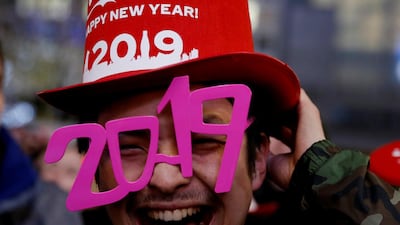 A man wears glasses shaped as the year 2019 as he attends a new year countdown event at Shibuya crossing in Tokyo, Japan, December 31, 2018. Reuters