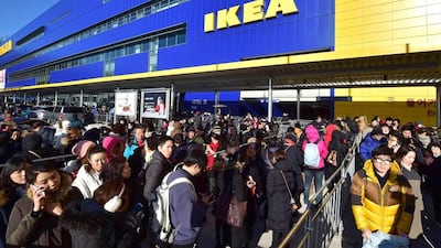 Shoppers wait in a long queue outside Ikea's in Gwangmyeong outlet in South Korea. Jung Yeon-Je / AFP