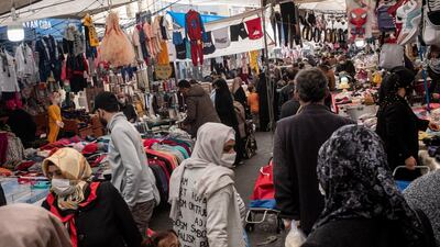 People shop at a local street market in Istanbul, Turkey. Getty Images