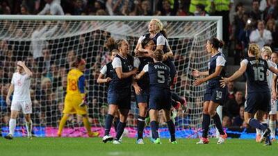 Abby Wambach celebrates scoring for the USA against Canada at Old Trafford in the Olympic women's football semi-final
