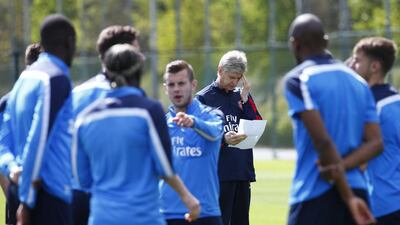 Arsenal manager Arsene Wenger leads Wednesday's training session in anticipation of the FA Cup final v Hull City on Saturday. Eddie Keogh / Reuters / May 14, 2014