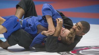 Humaid Al Kaabi takes down Seth Crossman en route to the gold. Antonie Robertson/The National