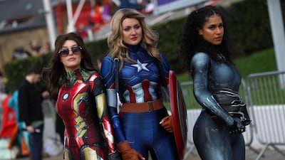 Cosplayers dressed as female versions of Marvel superheroes Iron Man, Captain America and the Silver Surfer. AFP