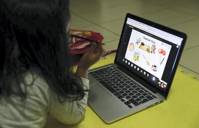 An FS 2 student attends online classes at her home in Masakin Al Furjan area in Dubai. Pawan Singh / The National