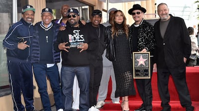 Mike Epps, Russell Simmons, Ice Cube, Chuck D, Hargitay, Ice-T and Dick Wolf pose for photos with Ice-T's new Walk of Fame plaque. AP