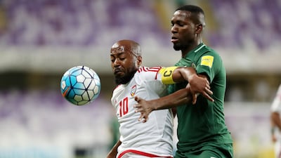 Veteran UAE player Ismail Matar, left, vies for the ball with Omar Ibrahim Othman of Saudi Arabia at Hazza bin Zayed Stadium on Tuesday. Chris Whiteoak / The National