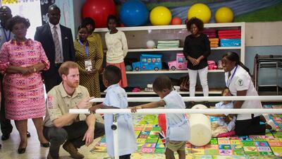 Prince Harry meets with the centre's young patients. EPA
