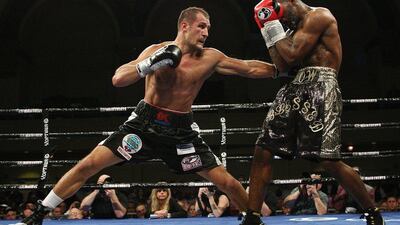 Sergey Kovalev, left, of Russia, punches Cedric Agnew, of the United States, during the sixth round of WBO light heavyweight boxing title in Atlantic City, N.J., on Saturday, March 29, 2014. Kovalev won by knockout in the seventh round. AP Photo/Tim Larsen
