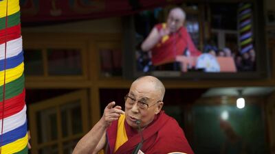 The Dalai Lama speaks to a crowd of devotees gathered to mark his 80th birthday in Dharmsala, India. (AP Photo/Ashwini Bhatia)